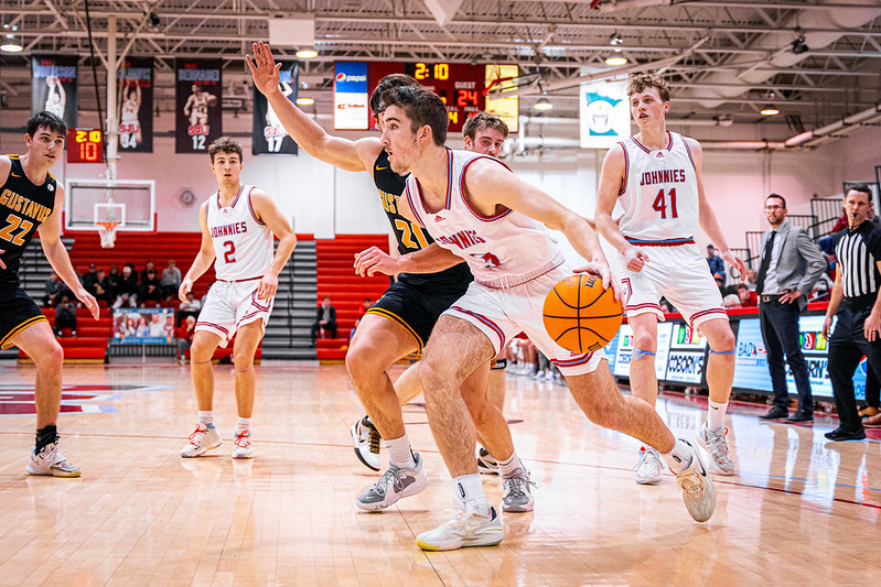Text: Join us Feb. 11 for Basketball Alumni Day Sexton Arena; photo of Jubie Alade 