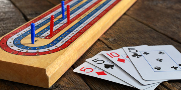Cribbage board and playing cards